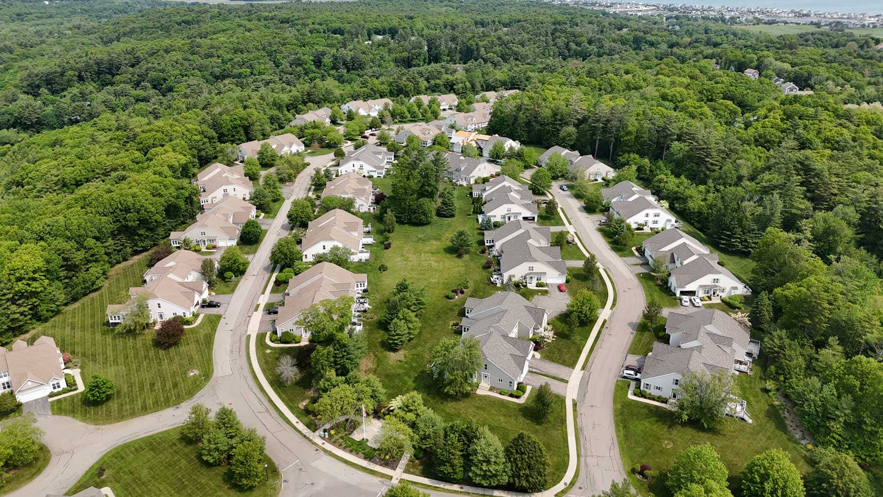 Completed roof replacement on a blue residential home in Massachusetts